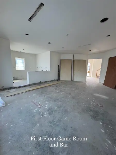 First floor Game Room with a Built-in Bar. Luxury First-floor Bar featuring a gold faucet, under-counter glass door refrigeration, and stainless-steel ice machine. The ultimate Entertainment hub with Direct Access to Outdoor Living spaces