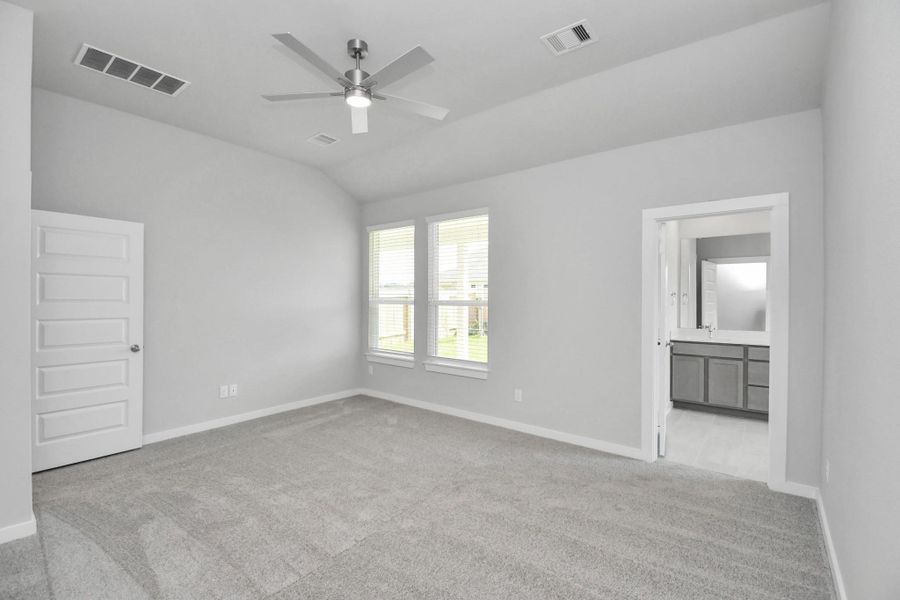 Escape the day's chaos and find serenity in the grand primary suite! Enjoy the comfort of plush carpeting, soothing paint hues, high ceilings, and large windows fitted with privacy blinds. Sample photo of completed home with similar floor plan. Actual colors and selections may vary. Escape the day's chaos and find serenity in the grand primary suite! Enjoy the comfort of plush carpeting, soothing paint hues, high ceilings, and large windows fitted with privacy blinds. Sample photo of completed home with similar floor plan. Actual colors and selections may vary.