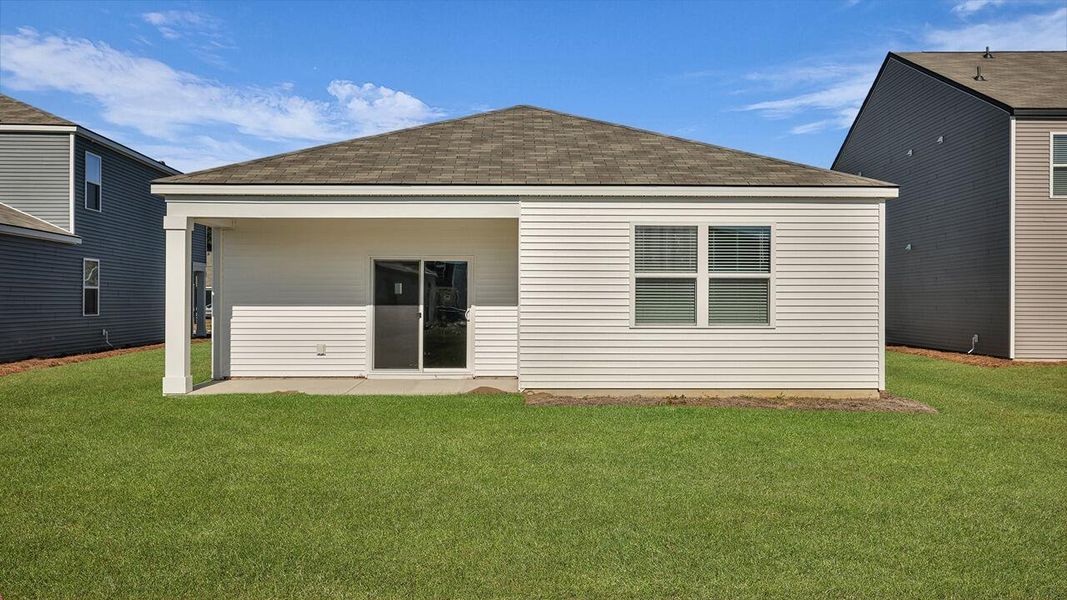 Exterior details and patio area of a home in Pine Hills at Cane Bay, Summerville (Image 22).