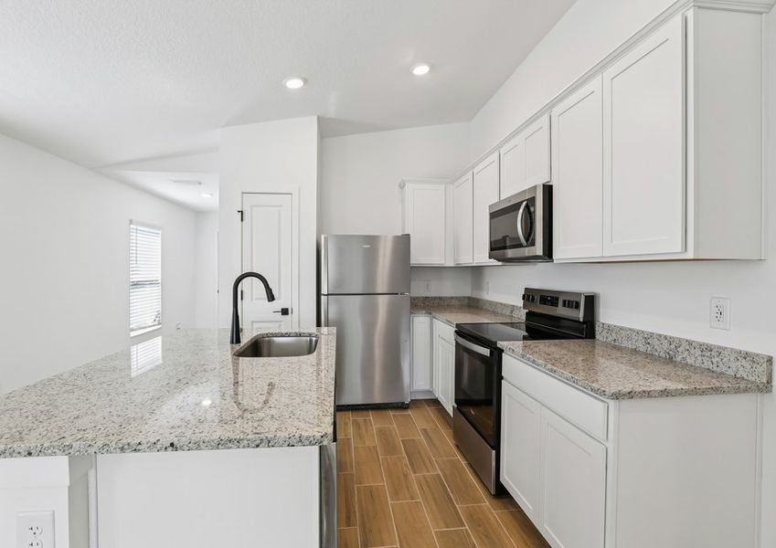 Each kitchen includes stainless steel appliances