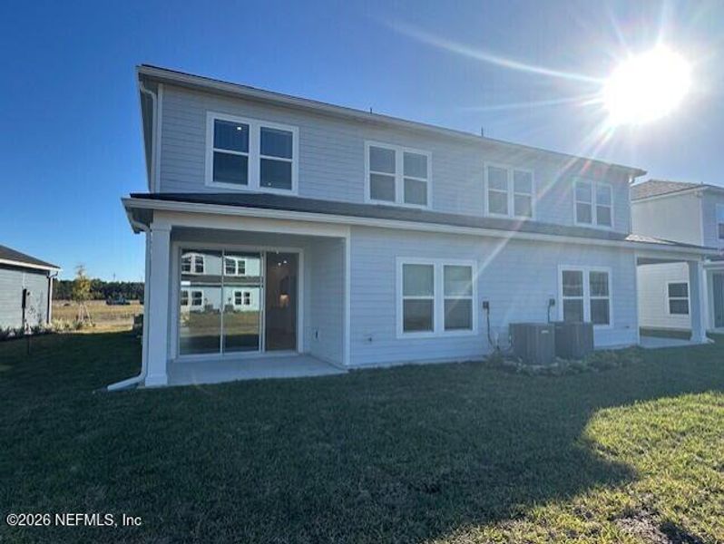 Exterior details and patio area of a home in Brook Forest - Townhomes, St. Augustine (Image 18).