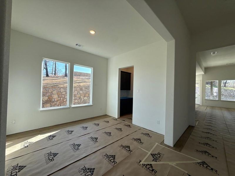 Empty room featuring plenty of natural light and recessed lighting