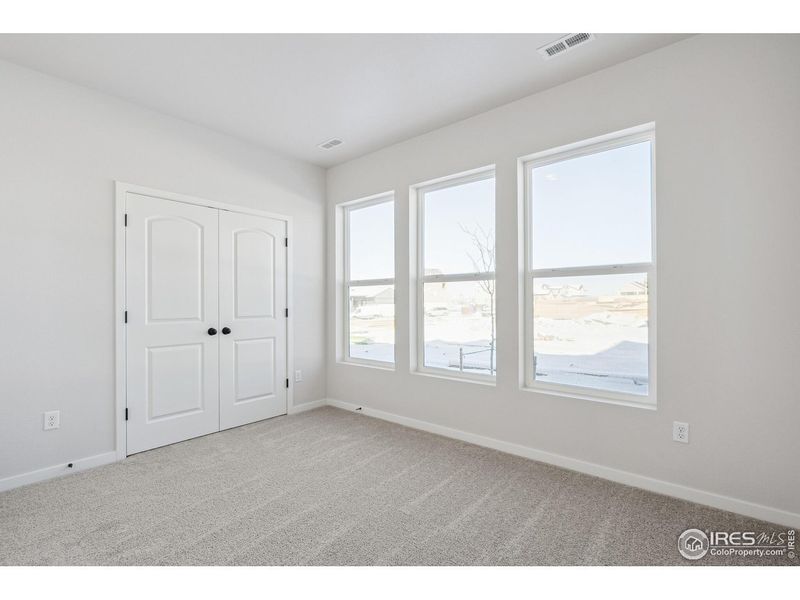 Spacious, unfurnished interior of a new home in Kinston Mainstreet Townhomes, Loveland (Image 20).