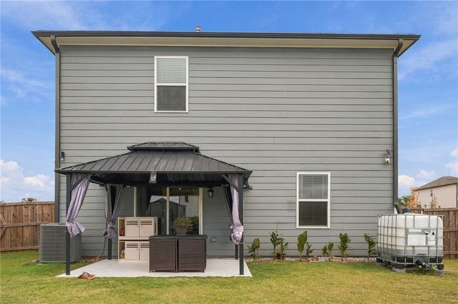 Exterior details and patio area of a home in Heritage Point, Hampton (Image 4).