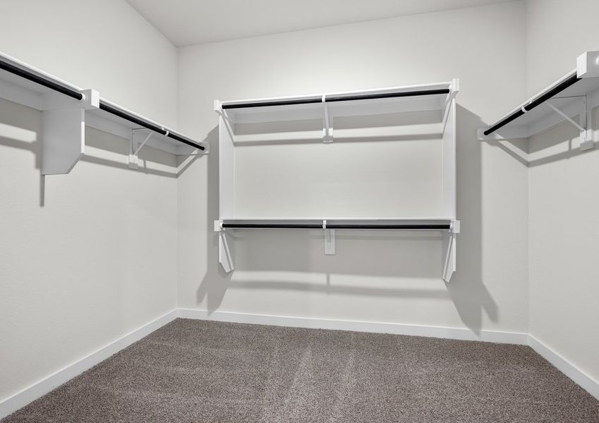 The master walk-in closet has plenty of hanging space and shelves for all of your clothes and belongings.
