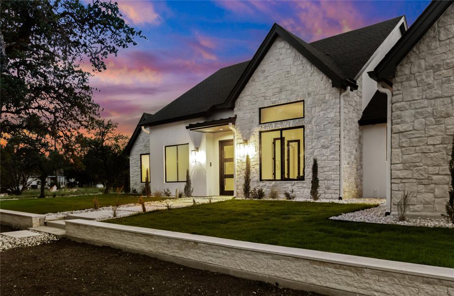 Front exterior of a new home in , Dripping Springs, TX, highlighting curb appeal (Image 21). Front exterior of a new home in , Dripping Springs, TX, highlighting curb appeal (Image 21).