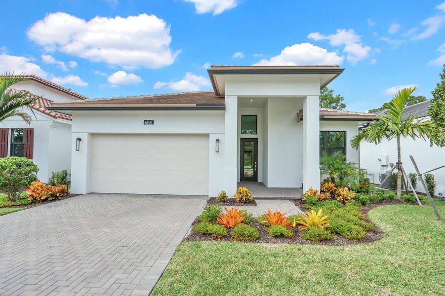 Exterior details and patio area of a home in Cove Royale, Stuart (Image 2).