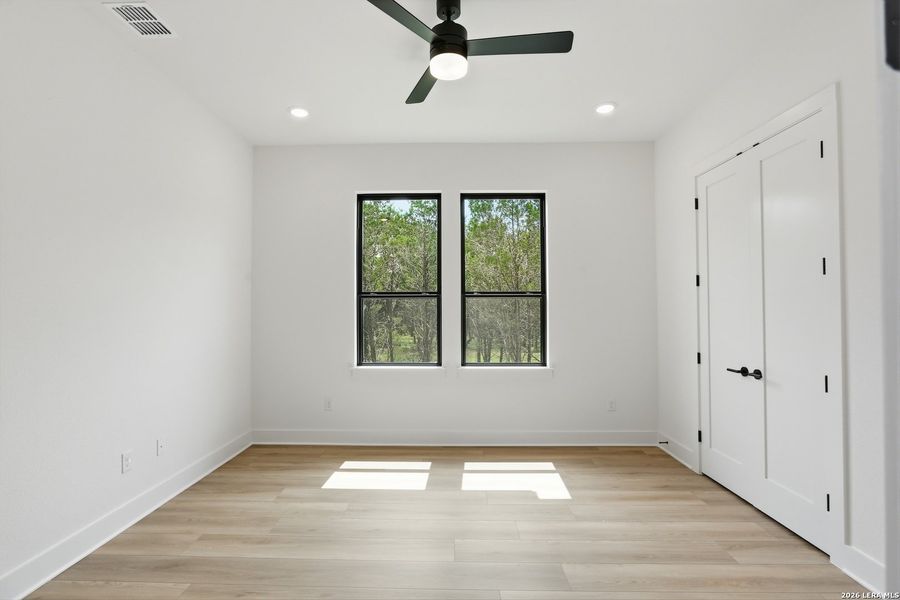 Spacious, unfurnished interior of a new home in Enchanted Bluff, San Antonio (Image 36).