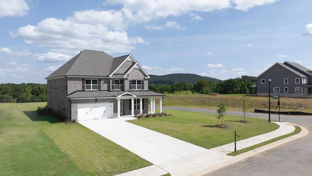 Front exterior of a new home in Thalley Creek Estates, Cumming, GA, highlighting curb appeal (Image 2).