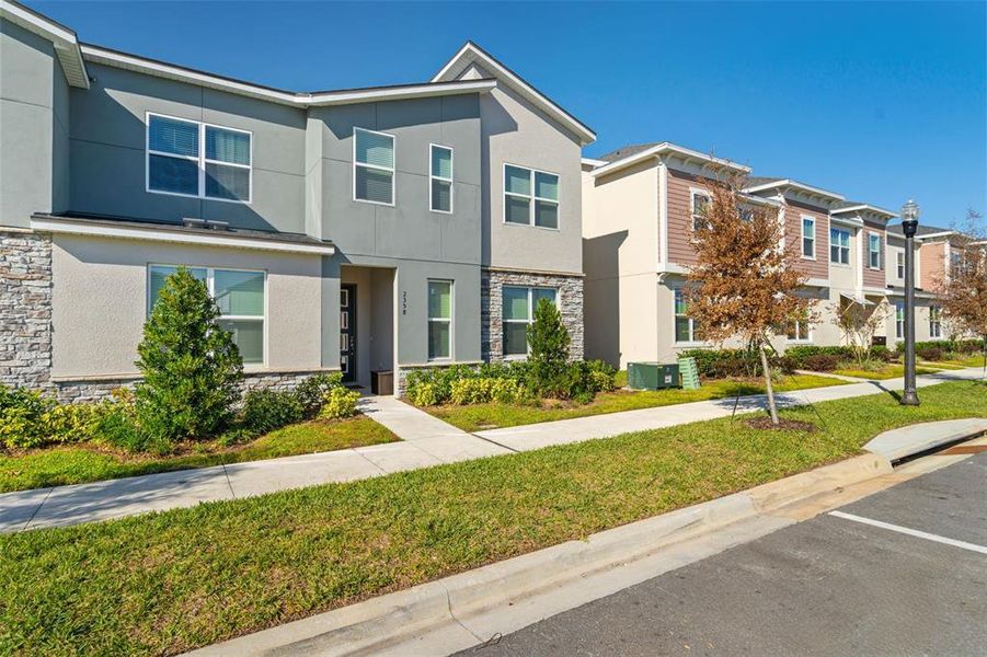 Front exterior of a new home in , Kissimmee, FL, highlighting curb appeal (Image 2). Front exterior of a new home in , Kissimmee, FL, highlighting curb appeal (Image 2).