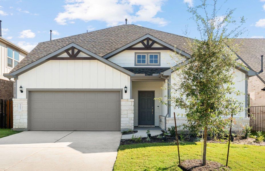 Front exterior of a new home in Saddleback at Santa Rita Ranch, Liberty Hill, TX, highlighting curb appeal (Image 1). Front exterior of a new home in Saddleback at Santa Rita Ranch, Liberty Hill, TX, highlighting curb appeal (Image 1).