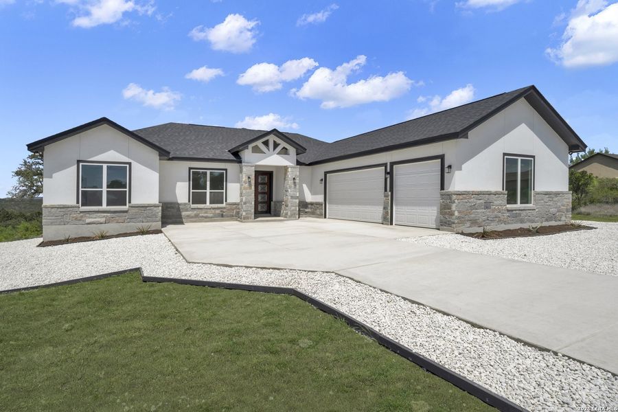 Front exterior of a new home in , Mico, TX, highlighting curb appeal (Image 10).