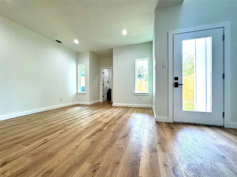 Dining room, half bathroom and door to backyard. Dining room, half bathroom and door to backyard.