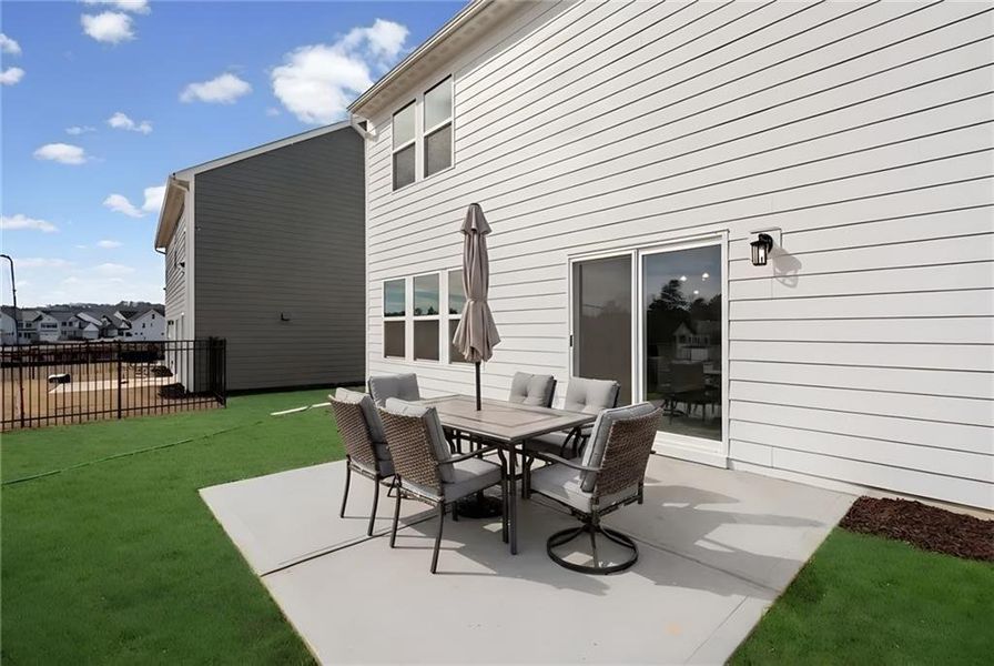 Exterior details and patio area of a home in Twin Lakes, Hoschton (Image 23).