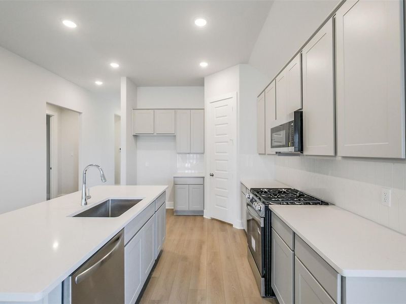 Furnished interior view inside a new home in Sunterra, Katy (Image 10).