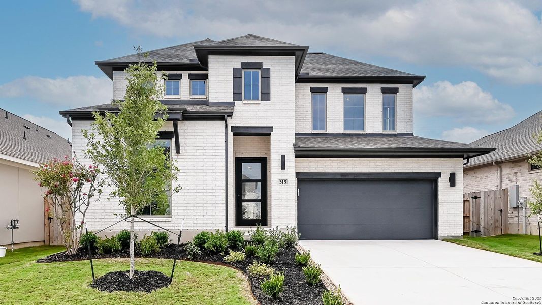 Front exterior of a new home in Legacy At Lake Dunlap 50', New Braunfels, TX, highlighting curb appeal (Image 21). Front exterior of a new home in Legacy At Lake Dunlap 50', New Braunfels, TX, highlighting curb appeal (Image 21).