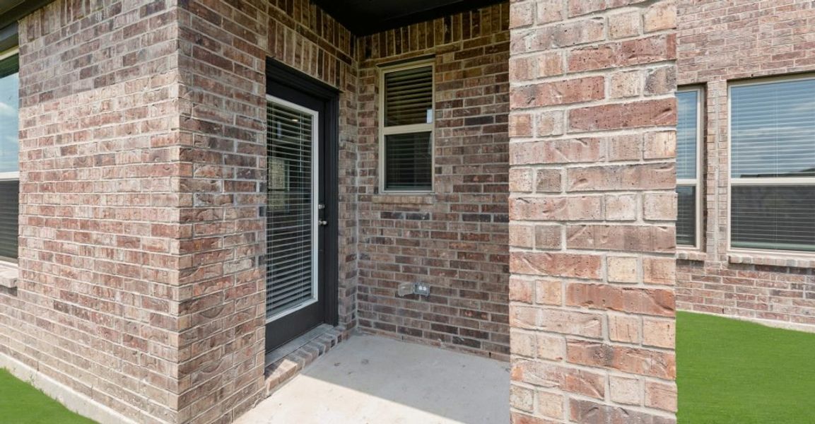 Representative exterior photo of a completed home built from the Raleigh by Impression Homes in Baker Farms, Cleburne, TX (Image 23).