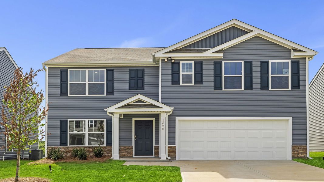 Front exterior of a new home in Cedar Gap, Fountain Inn, SC, highlighting curb appeal (Image 1). Front exterior of a new home in Cedar Gap, Fountain Inn, SC, highlighting curb appeal (Image 1).