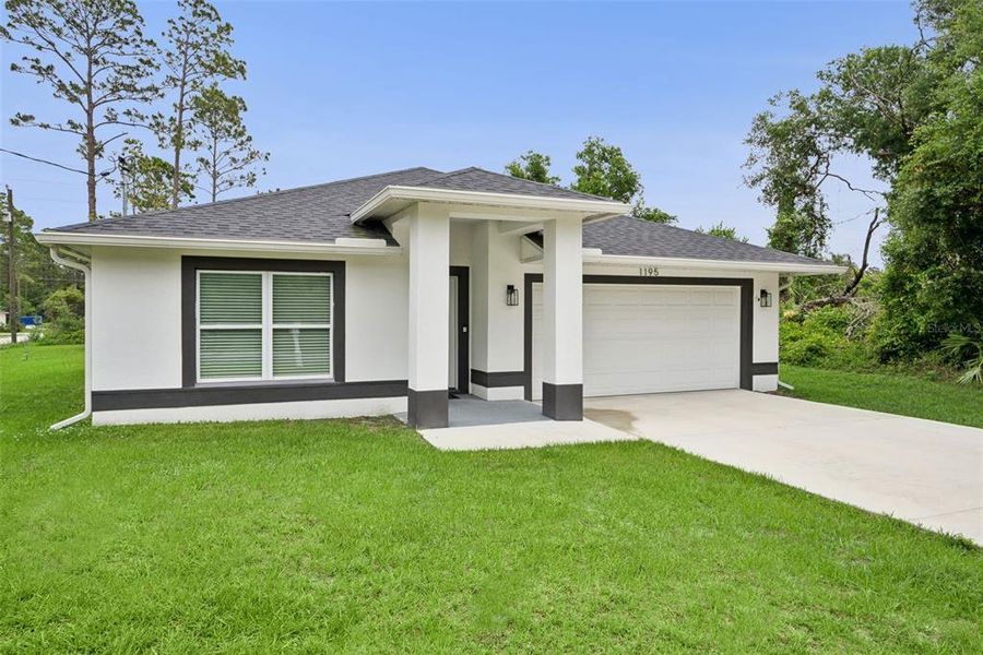 Front exterior of a new home in , Deland, FL, highlighting curb appeal (Image 17).