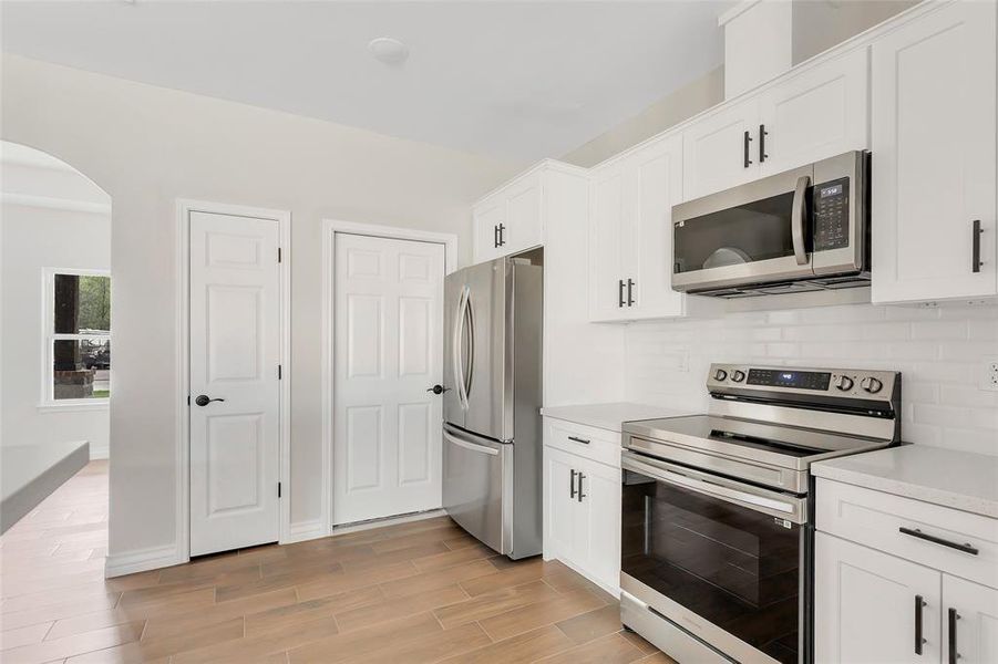 Kitchen with all stainless steel appliances. Refrigerator included with acceptable offer.