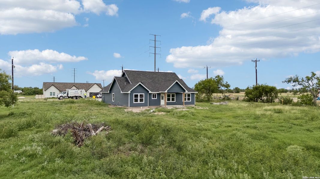 Front exterior of a new home in , Natalia, TX, highlighting curb appeal (Image 23).