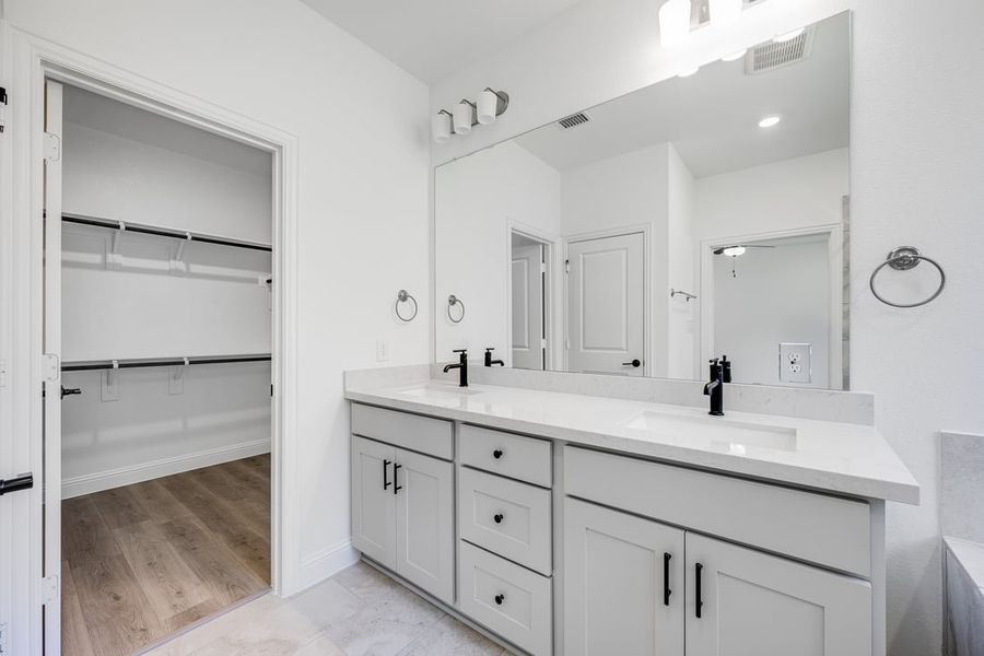 Representative furnished interior of a home built from the Camelia by Taylor Morrison in Stoneridge, Melissa (Image 12).