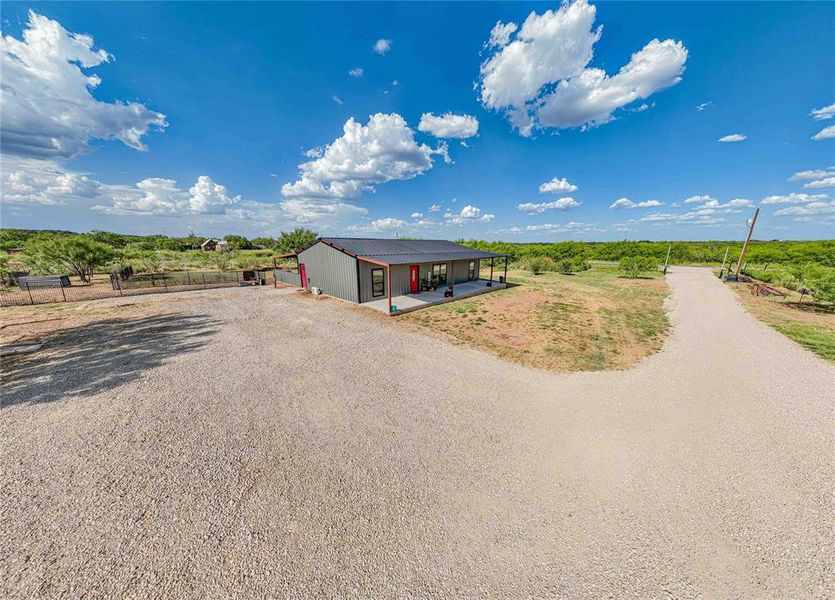 View of front facade featuring driveway