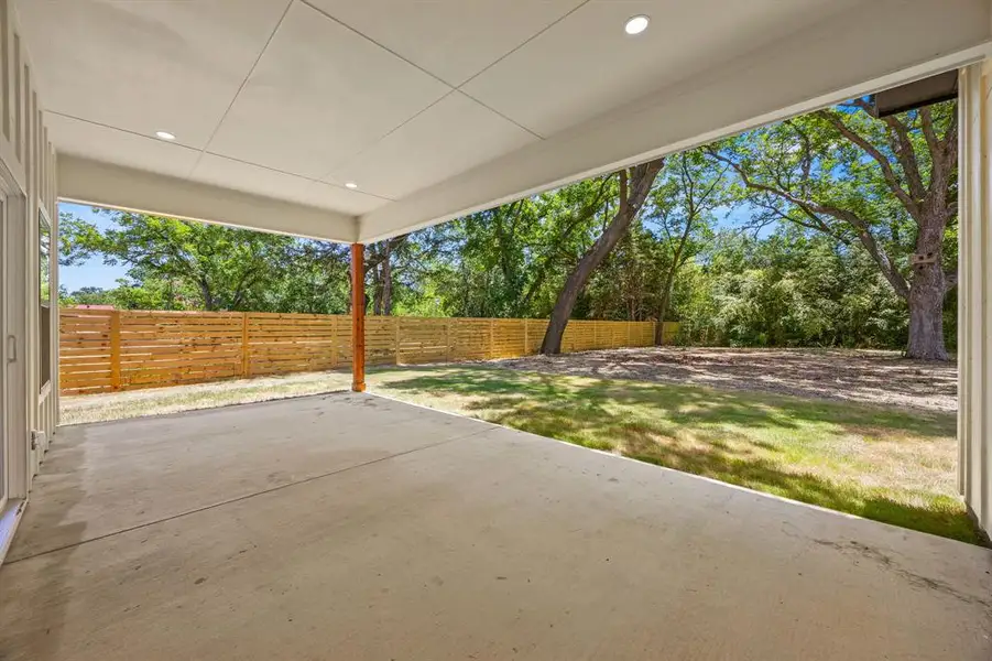 The expansive covered patio provides a comfortable outdoor retreat, offering a spacious setting to relax, dine, and entertain while enjoying the privacy of the large backyard. The expansive covered patio provides a comfortable outdoor retreat, offering a spacious setting to relax, dine, and entertain while enjoying the privacy of the large backyard.