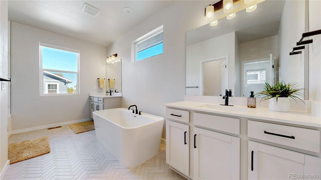Gorgeous primary bathroom! Look at the tile!