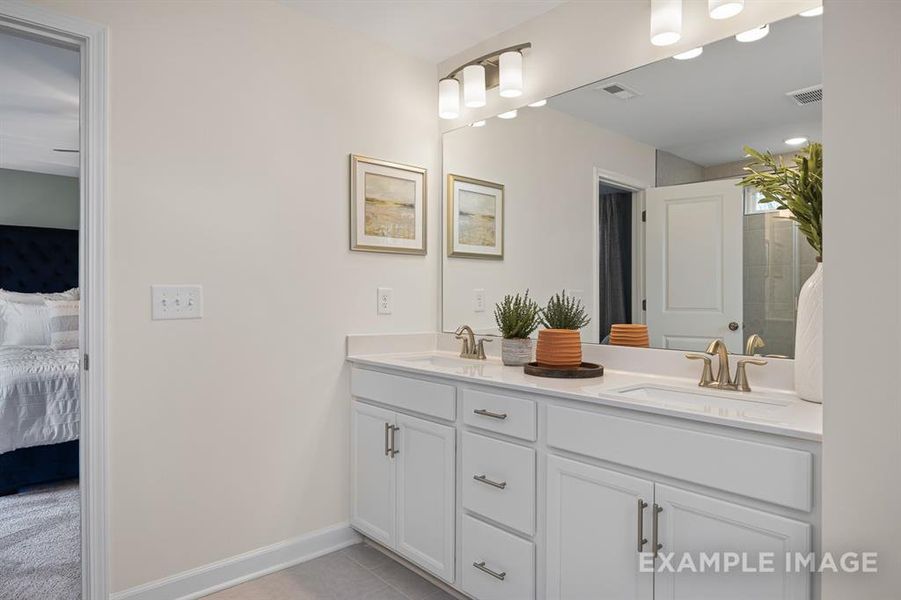 Bathroom featuring vanity and tile patterned floors