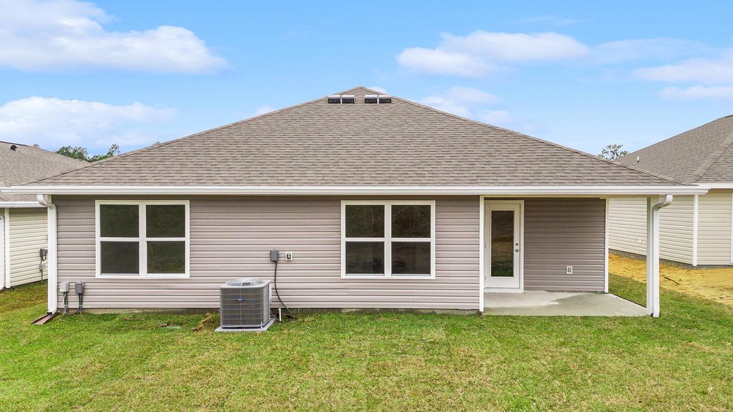 Exterior details and patio area of a home in Magnolia at the Bluffs Phase 3, Freeport (Image 4).