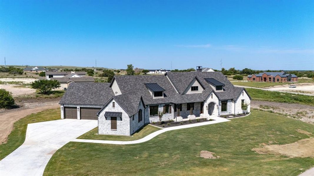 Long Driveway Featuring  Three Car Garage Access