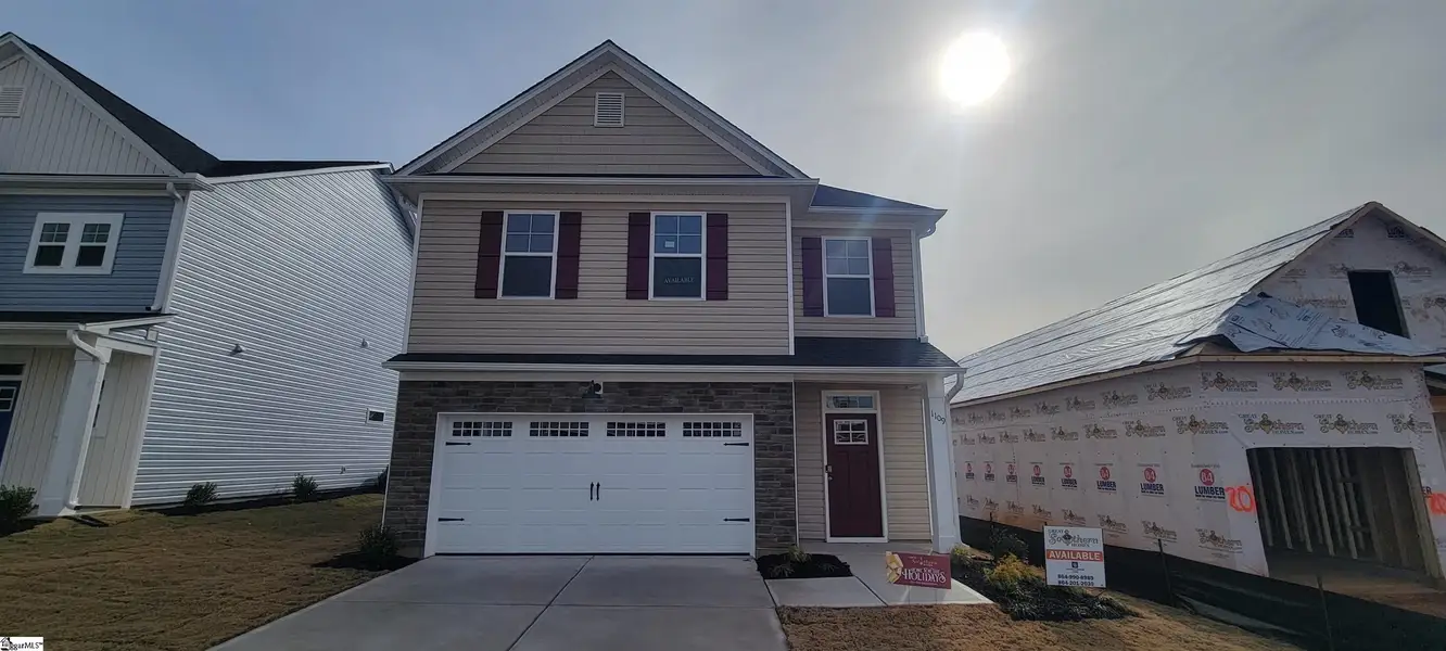 Front exterior of a new home in Halton Oaks, Spartanburg, SC, highlighting curb appeal (Image 1).