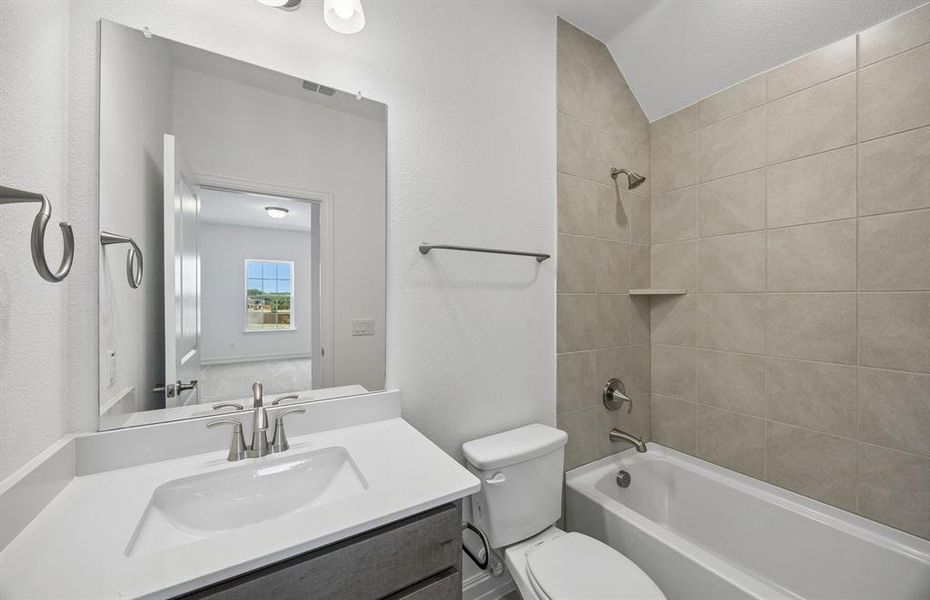 Secondary bath with tile surrounded shower