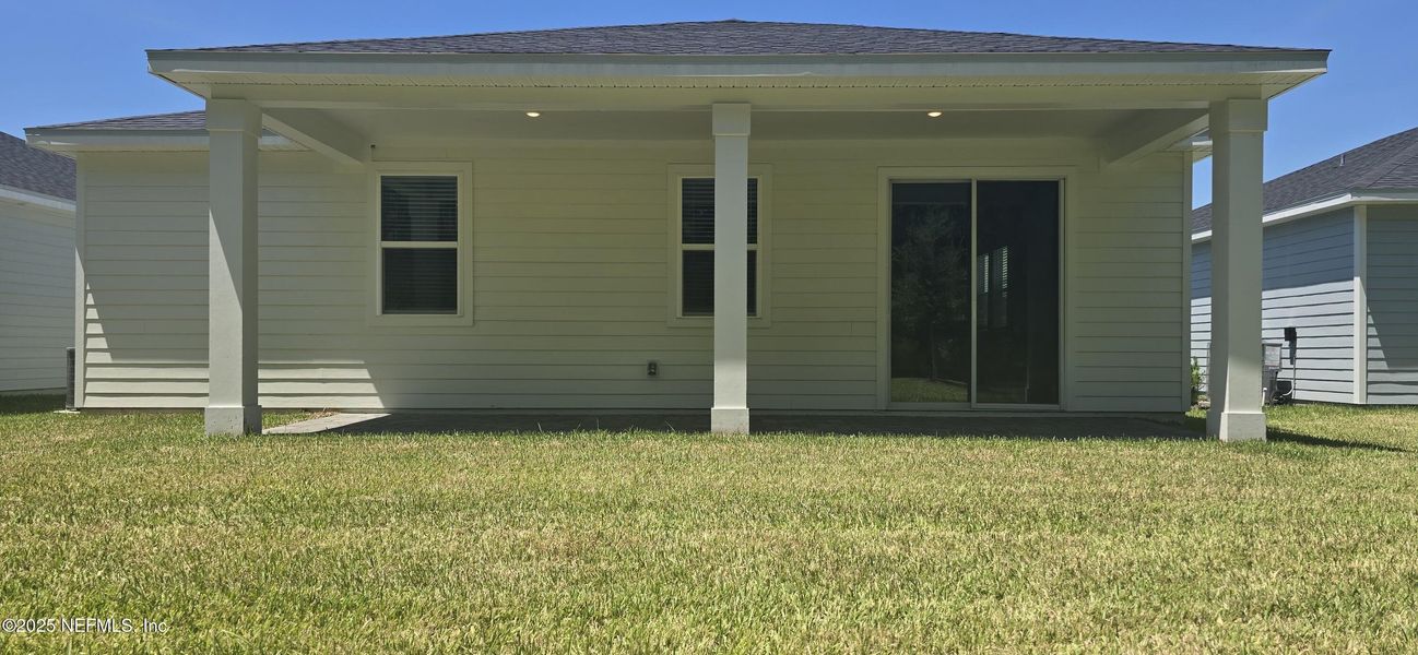 Front exterior of a new home in Colbert Landings, Palm Coast, FL, highlighting curb appeal (Image 18).