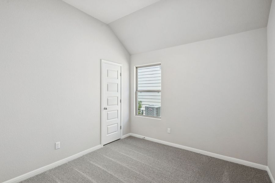 Bedroom in the Pine home plan by Trophy Signature Homes - REPRESENTATIVE PHOTO
