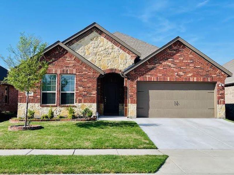 Front exterior of a new home in , Fate, TX, highlighting curb appeal (Image 1). Front exterior of a new home in , Fate, TX, highlighting curb appeal (Image 1).