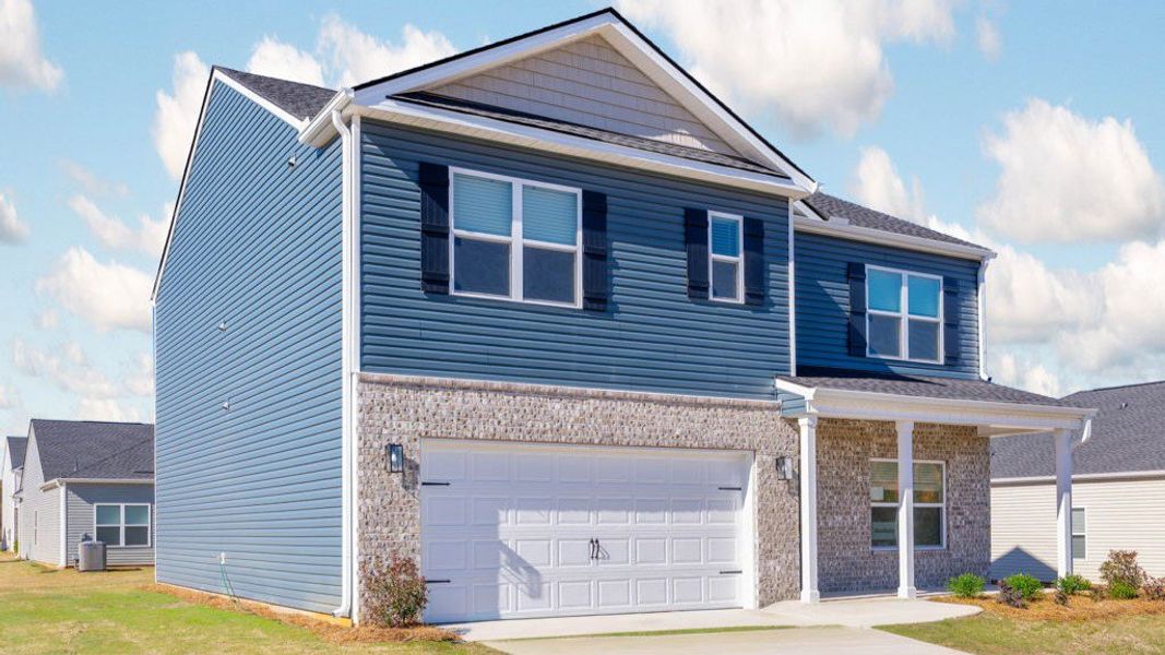Front exterior of a new home in The Cove at Thrasher Landing, Hixson, TN, highlighting curb appeal (Image 2).