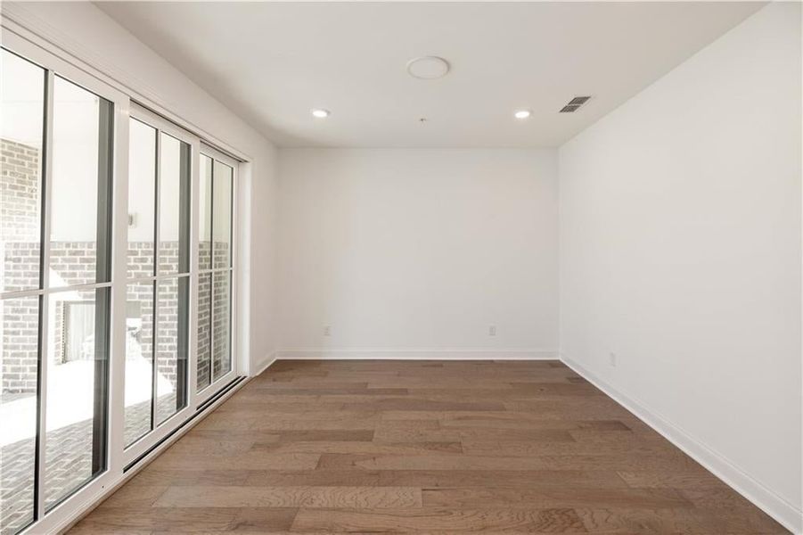 The terrace level flex space has a 9' slider door that opens to create the perfect indoor/outdoor entertaining space.