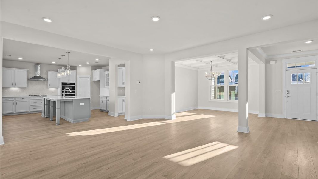 Memorable moments begin in this elegant, open family room with hardwood flooring and refined finishes