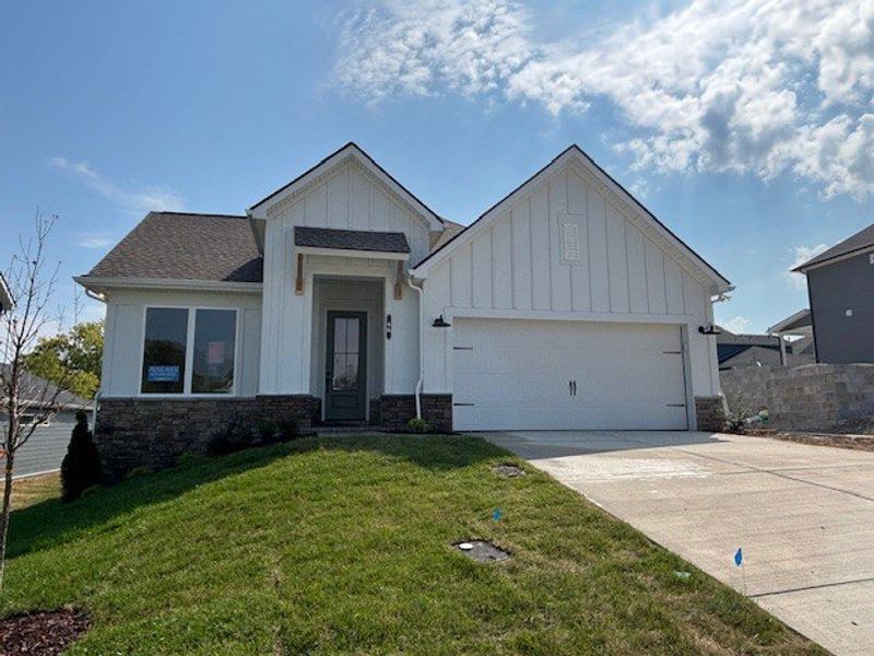 Front exterior of a new home in The Preserve at Five Oaks, Lebanon, TN, highlighting curb appeal (Image 1).