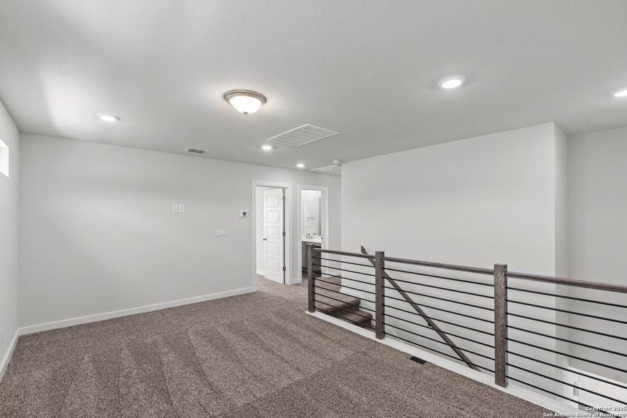 Spacious, unfurnished interior of a new home in The Meadows at Hunters Ranch, San Antonio (Image 26).