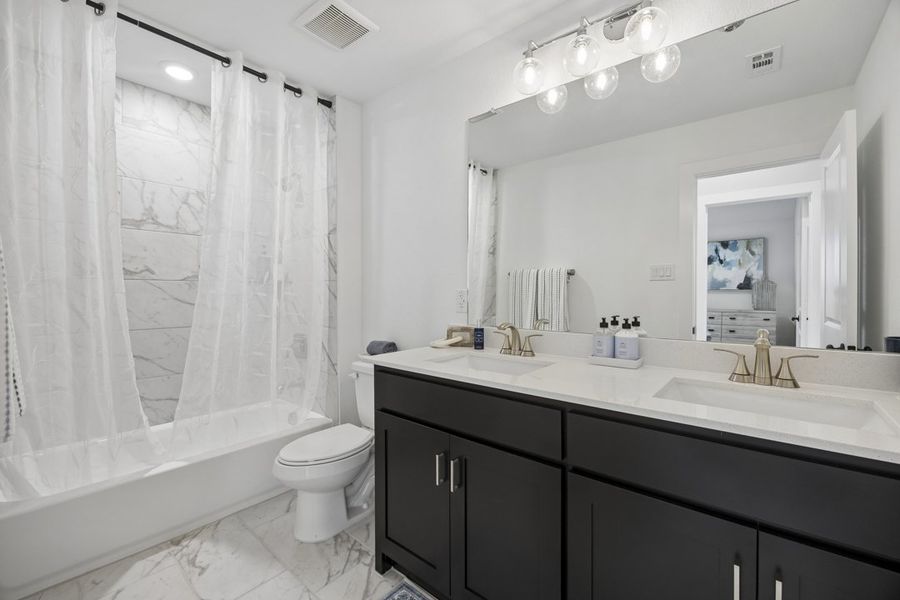 Representative furnished interior of a home built from the The Milan by Lillian Custom Homes in Polo Ridge, Forney (Image 39).
