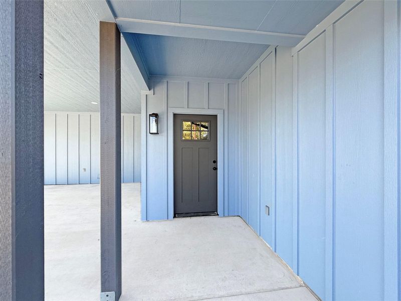 Entrance to property with board and batten siding