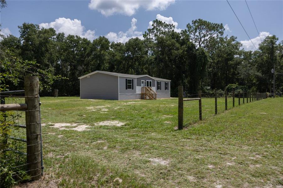 Front exterior of a new home in , Fort White, FL, highlighting curb appeal (Image 23).