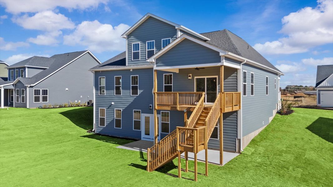 Rear covered porch offers a private, first-rate setting for outdoor enjoyment