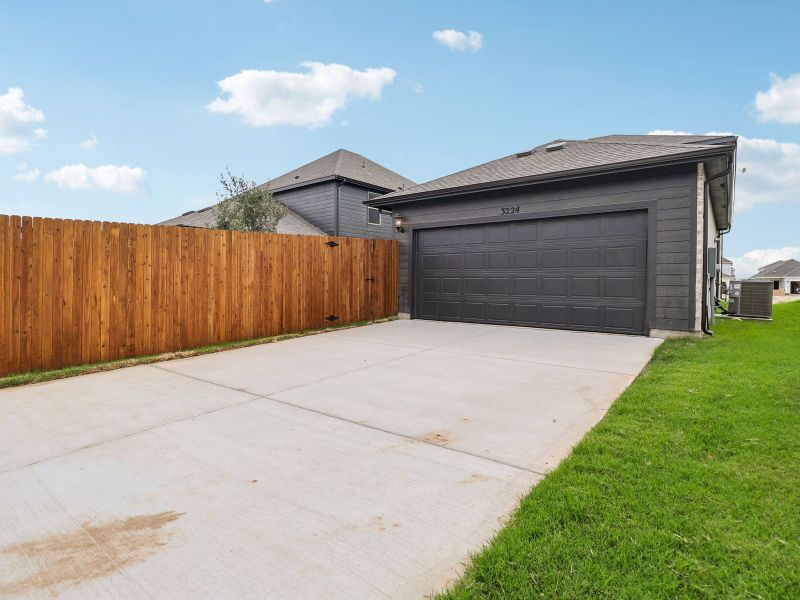 Exterior details and patio area of a home in Cibolo Hills West - Spring Series, Fort Worth (Image 16).