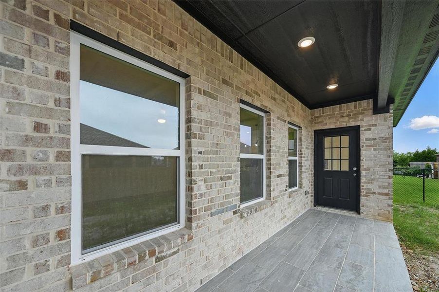 Property entrance with brick siding