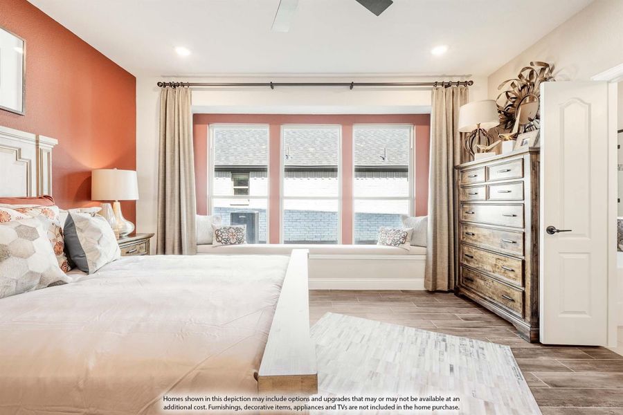 Bedroom with king bed, window seat, wood dresser, and accent wall with hardwood-style floors Bedroom with king bed, window seat, wood dresser, and accent wall with hardwood-style floors
