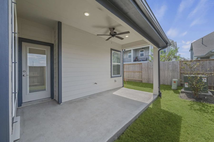 Representative exterior details of a home built from the Carriagehouse by Chesmar Homes in Meridiana Townhomes, Iowa Colony (Image 43).